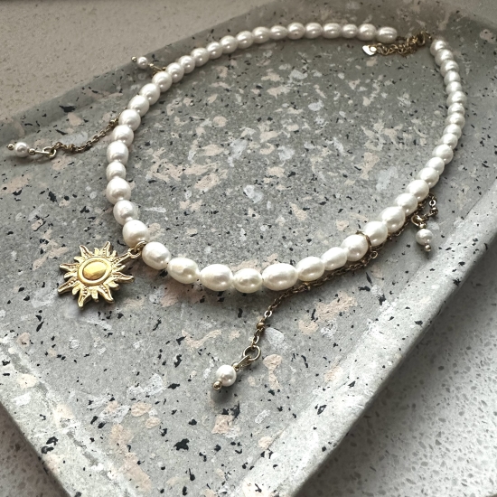 Naszyjnik z perłami i zawieszką Słońce
